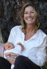 Dawn Dana, certified midwife in Ventura and Santa Barbara holds a baby delivered by homebirth