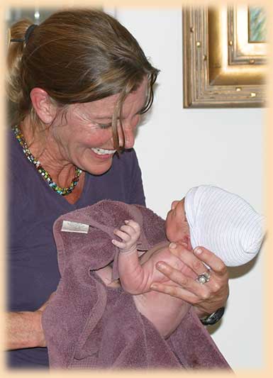 Dawn Dana, certified midwife in Ventura and Santa Barbara joyfully welcomes infant delivered by homebirth